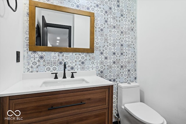 bathroom with vanity and toilet