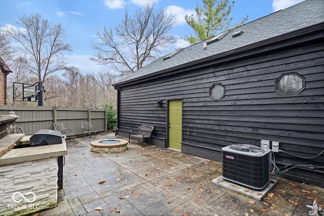 view of patio / terrace with cooling unit and exterior kitchen