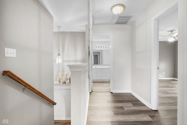 corridor featuring dark hardwood / wood-style flooring