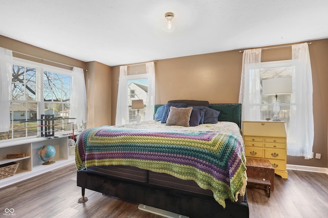 bedroom featuring dark hardwood / wood-style flooring