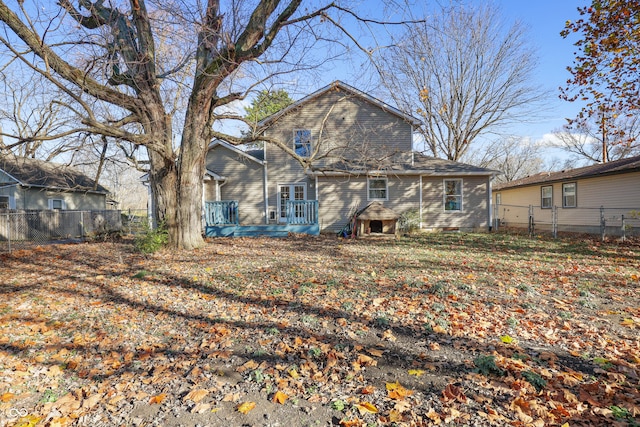 back of property with a deck