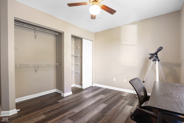 office space with ceiling fan and dark wood-type flooring