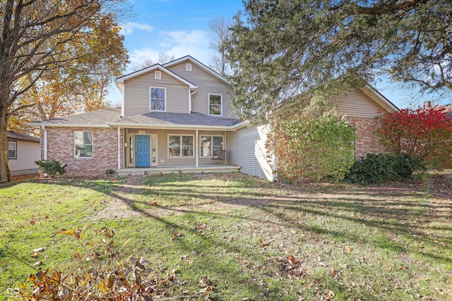 view of front of property with a porch and a front yard