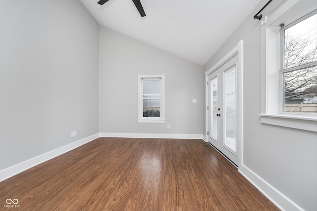 interior space with dark hardwood / wood-style floors, ceiling fan, and lofted ceiling