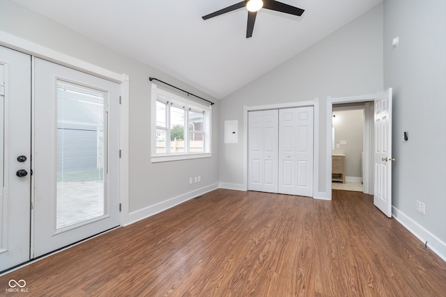 unfurnished bedroom featuring ceiling fan, high vaulted ceiling, and hardwood / wood-style flooring