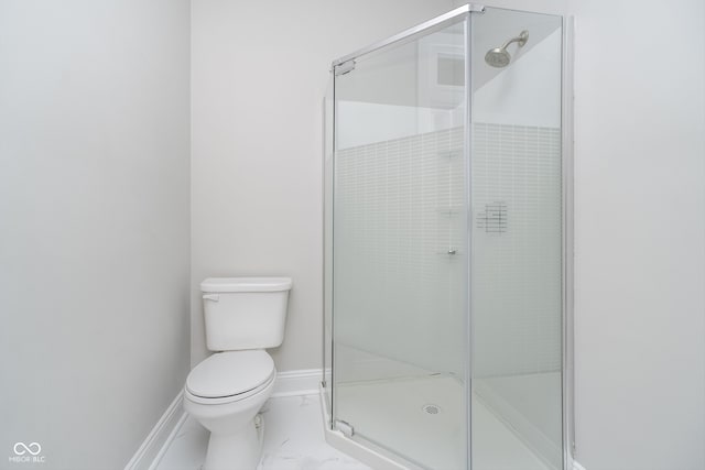 bathroom with an enclosed shower and toilet