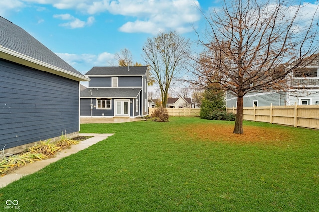 view of yard featuring a patio area and french doors