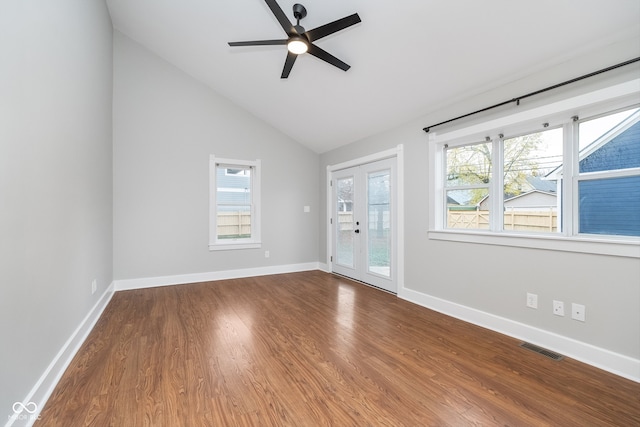 empty room featuring hardwood / wood-style floors, ceiling fan, and lofted ceiling