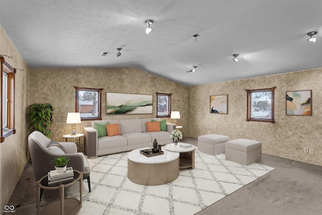 living room with lofted ceiling and light colored carpet