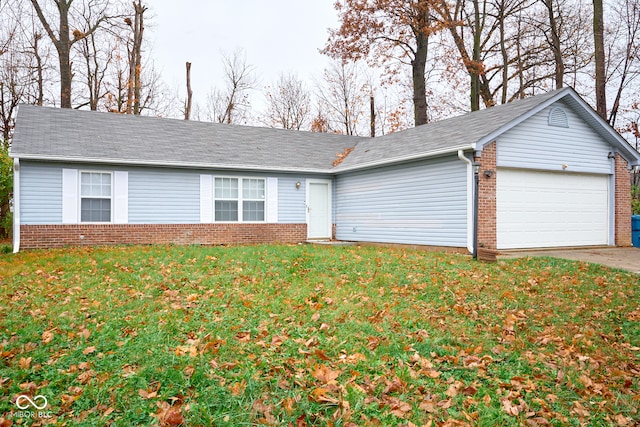 single story home featuring a garage and a front lawn