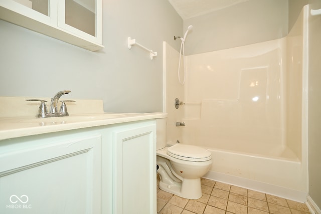 full bathroom with tile patterned floors, toilet, vanity, and washtub / shower combination