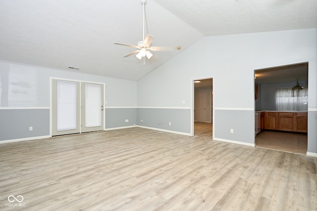 spare room with ceiling fan, high vaulted ceiling, and light hardwood / wood-style floors