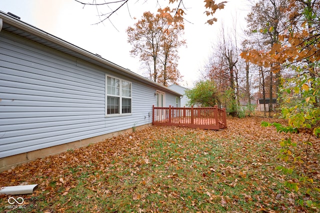 view of yard featuring a wooden deck