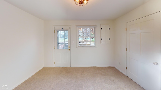 interior space with electric panel and light carpet