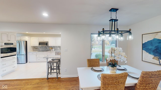 dining room featuring light hardwood / wood-style floors