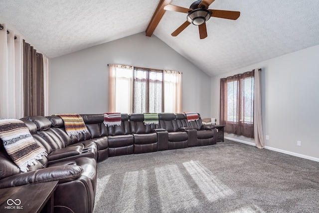 living room with vaulted ceiling with beams, ceiling fan, carpet floors, and a textured ceiling