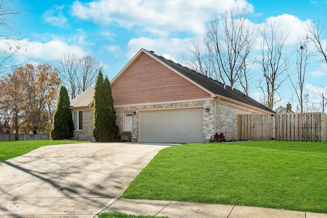 view of front of house featuring a garage and a front yard