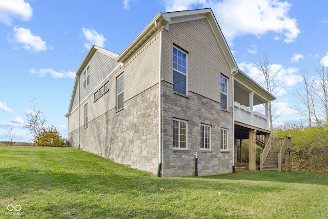 view of property exterior with a lawn and a wooden deck