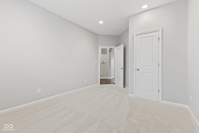 unfurnished bedroom featuring light colored carpet