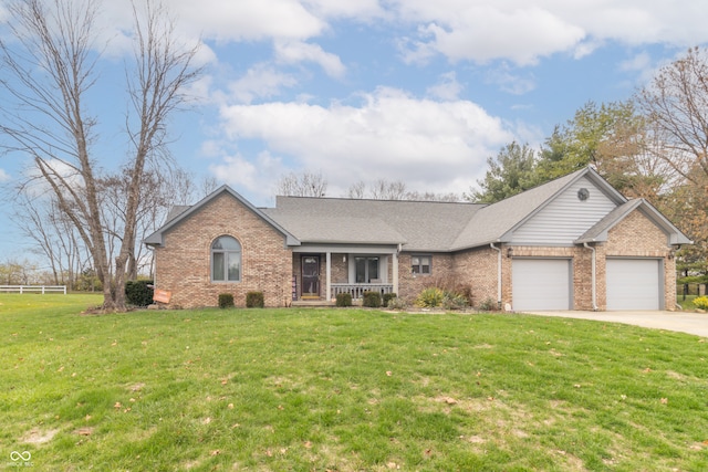 single story home with a garage and a front lawn