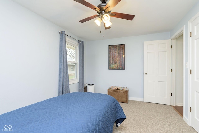 bedroom with baseboards, carpet, and a ceiling fan