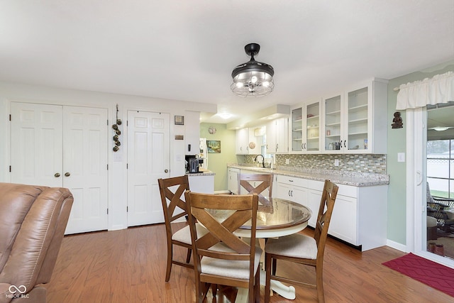 dining room featuring baseboards and dark wood-style flooring