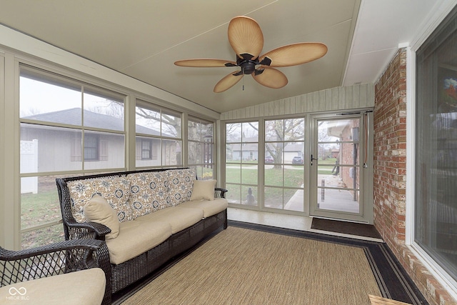 sunroom / solarium with a ceiling fan