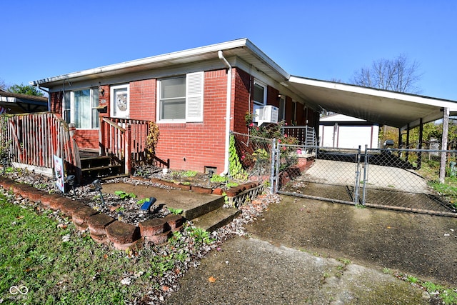 view of property exterior with a carport and an outdoor structure