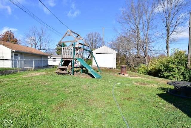 view of yard featuring an outdoor structure and a playground