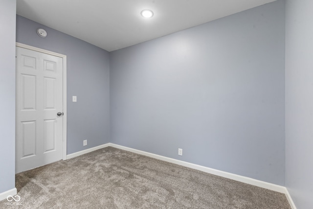 unfurnished room featuring carpet flooring