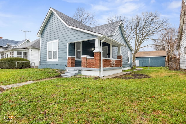 bungalow-style home featuring a front lawn