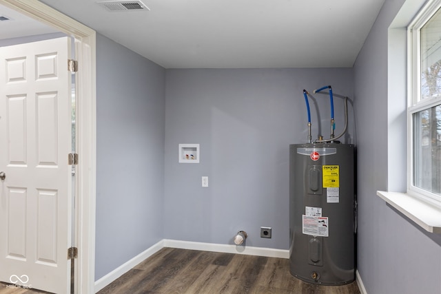 utility room featuring water heater