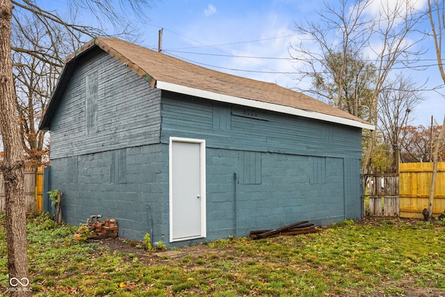 garage featuring a lawn