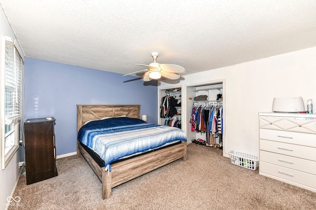 carpeted bedroom featuring a textured ceiling and ceiling fan