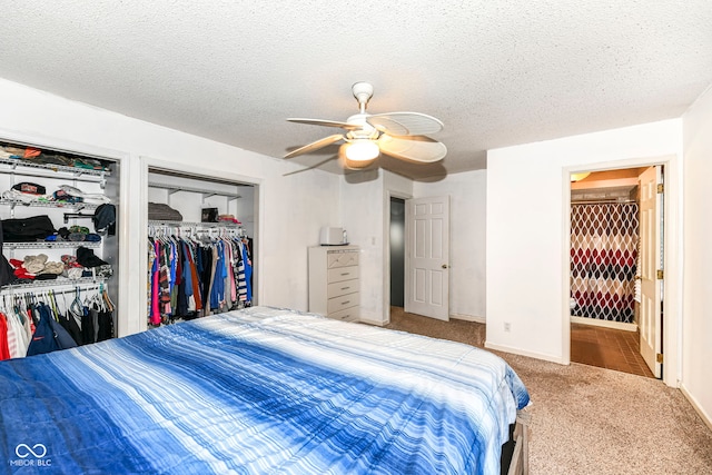 bedroom featuring carpet flooring, ceiling fan, and a textured ceiling