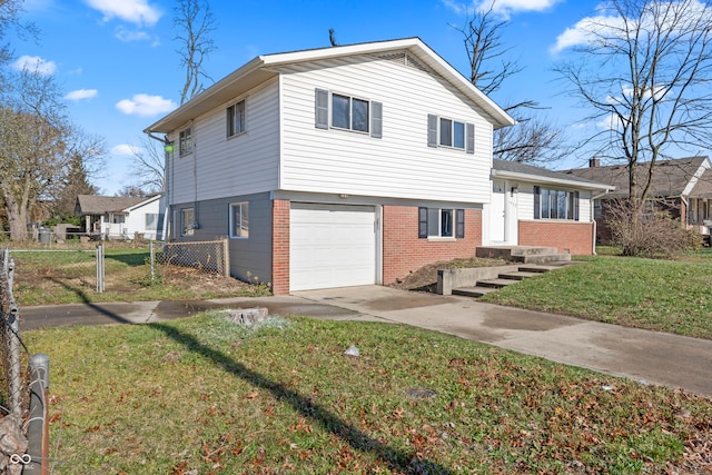 split level home featuring a front yard and a garage