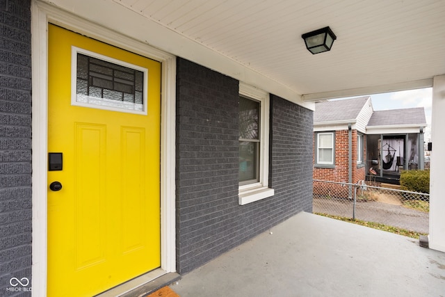 property entrance featuring a porch