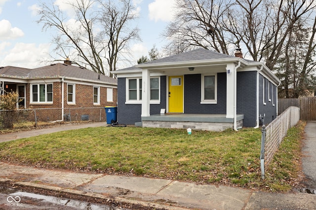 bungalow featuring a porch and a front yard