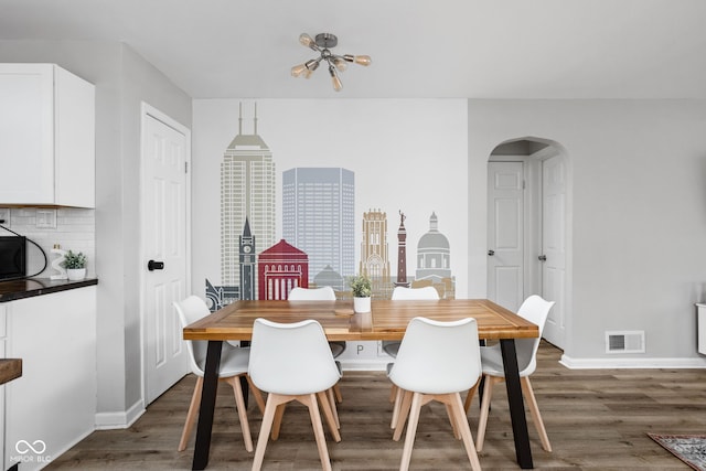 dining area featuring dark hardwood / wood-style floors