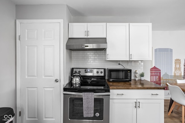 kitchen featuring wood counters, backsplash, stainless steel range with electric cooktop, ventilation hood, and white cabinets