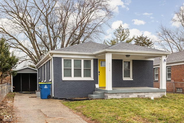 view of front of home with a front lawn and covered porch