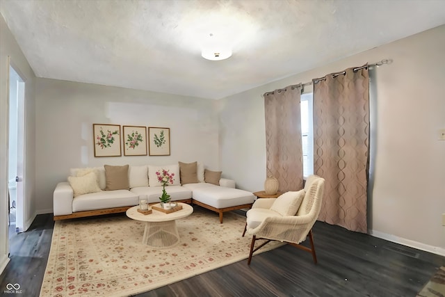 living room featuring dark wood-type flooring