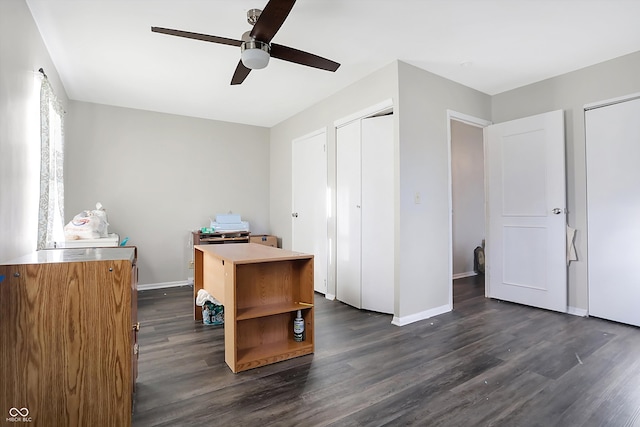 office space featuring ceiling fan and dark wood-type flooring