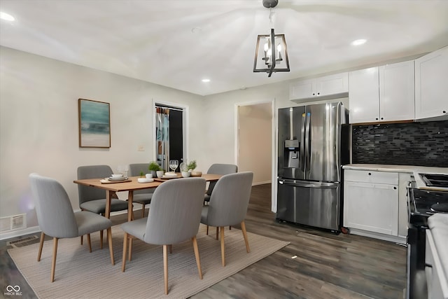 8902 Carla Dr, Indianapolis, IN 46219 - dining area with a chandelier, dark wood-type flooring, and recessed lighting