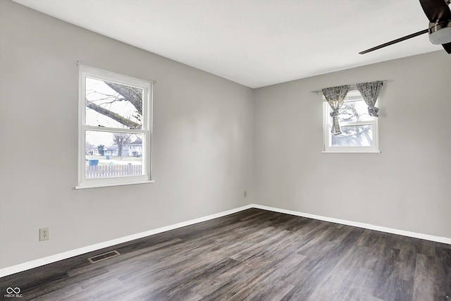 8902 Carla Dr, Indianapolis, IN 46219 - spare room with ceiling fan and dark hardwood / wood-style flooring