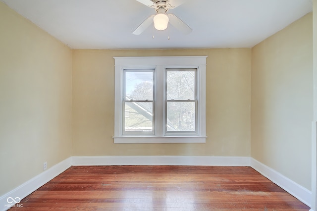 unfurnished room featuring hardwood / wood-style flooring and ceiling fan