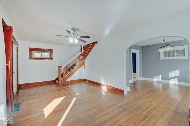 interior space featuring wood-type flooring and ceiling fan