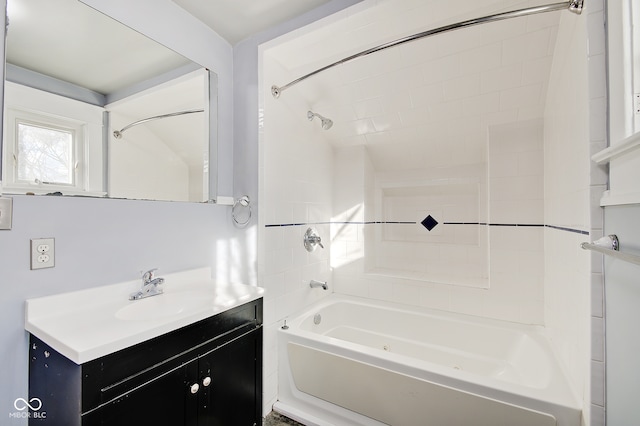 bathroom with vanity and tiled shower / bath