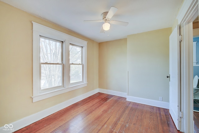 empty room featuring hardwood / wood-style floors and ceiling fan