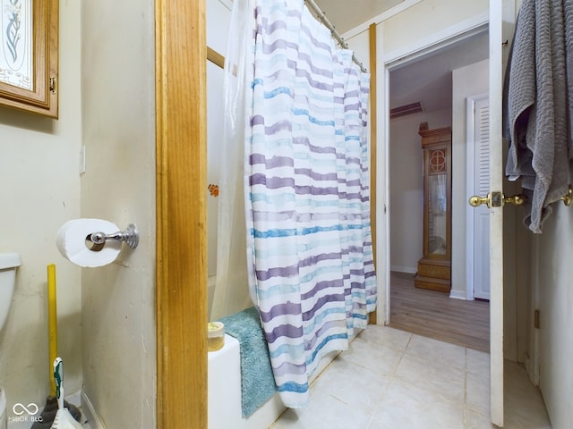 bathroom with hardwood / wood-style flooring